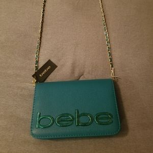 Bebe small turquoise cross body bag, with gold chain strap. 7.5" x 5"